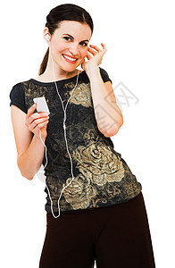 快乐的女士聆听MP3闲暇耳塞幸福享受听力微笑娱乐姿势白色机动性图片