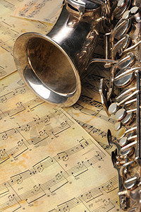 旧萨克斯音和音符萨克斯音乐黑色音乐家黄色笔记女高音金子乐器床单图片