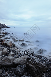 夜间的海阳光场景日落海景假期地平线石头风暴卵石液体图片