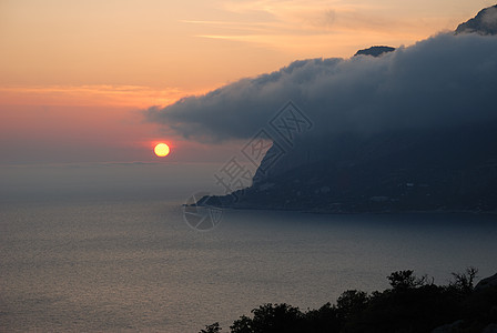 日落场景天堂戏剧性天气橙子阳光海洋日出岛屿波纹图片