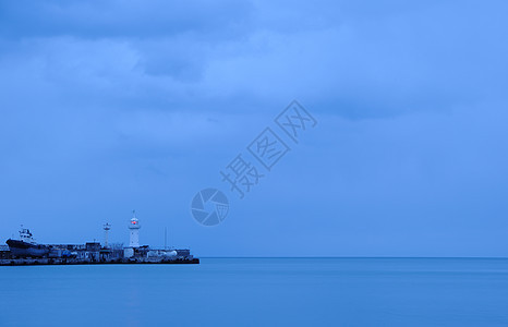 灯泡海滩风景蓝色海浪天空灯塔风暴地平线危险太阳图片