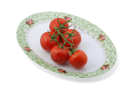 在盘子上隔离的番茄沙拉装饰品点燃叶子反射水果农业收获美食果汁图片