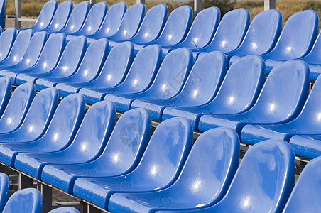 手扶椅子体育场蓝色展示观众比赛运动座位扇子数字塑料背景图片