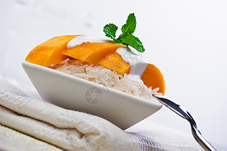 泰芒芒果粘黏性甜米德塞特高牛马孟油炸种子坚果文化牛奶水果美食甜点肉桂椰子背景图片