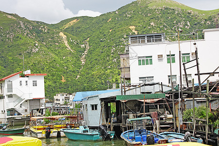 Tai O钓鱼村 香港有高楼小屋住宅建筑旅行村庄钓鱼蓝色窝棚棚户区天空场景图片