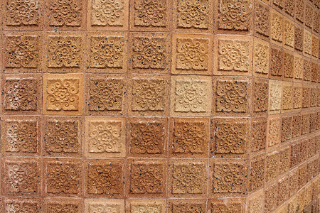 泰国棕色墙设计建筑石头艺术背景图片