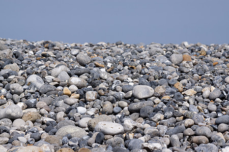 沿海岸的弗林斯通地面碎石圆形瓦砾岩石材料巨石石头灰色硅胶图片