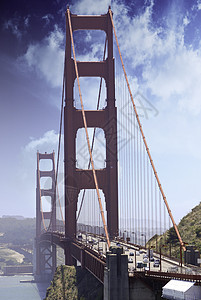 旧金山的金门大桥汽车景观日落巡航运输游客城市吸引力工程历史图片