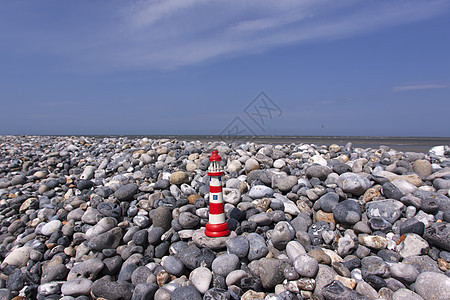 沿海石石碑上的小型模小灯塔花岗岩瓦砾地面硅胶碎石巨石石头岩石材料砾石图片
