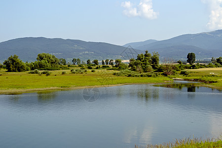 水坝湖湖天空太阳石头反射风景阳光顶峰地标旅游美丽图片