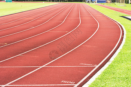 正在运行轨道挑战运动员竞争运动曲线竞赛车道锻炼体育场场地背景图片
