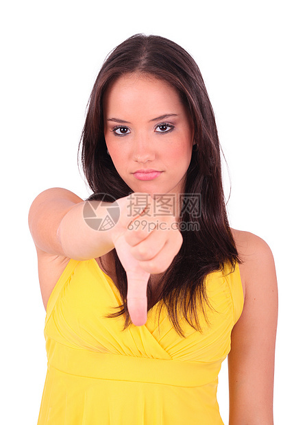 年轻而失望的女性 表现了手势低落的拇指图片