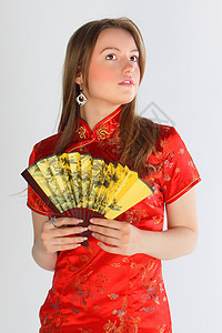 穿红色中国裙子的女孩女人情绪工作室青年乐趣幸福微笑一张照片衣服图片
