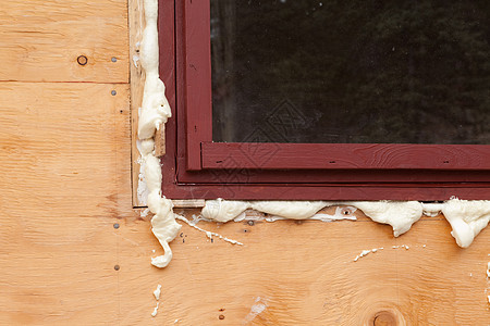 PU泡沫填补空白木板聚氨酯玻璃绝缘窗户黄色装修房子海豹差距图片