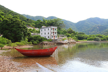 沿岸的孤立船只海岸线运输棕榈支撑太阳游客蓝色旅行海洋海滩图片