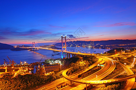 香港日落时的清马桥街道曲线蓝色运动辉光天空运输海洋城市市中心图片