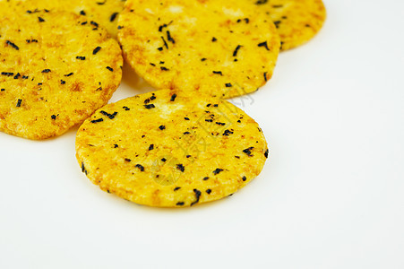 圆金饼干白色传统糖果新年食物黄色金子味道面包海藻背景图片