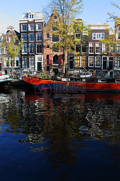 宁静的阿姆斯特丹运河和家用船游客商务景观观光荷卢房子首都城市教会历史性图片