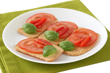 番茄烤面包盘子食物餐巾野餐小吃面包早餐绿色背景图片