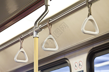 处理列车内站立乘客事宜带子作品民众车辆平衡塑料旅行栏杆手柄电车图片