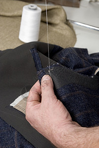缝纫手的细细工厂别针工艺维修细绳接缝裁缝缝纫夹克衣服图片