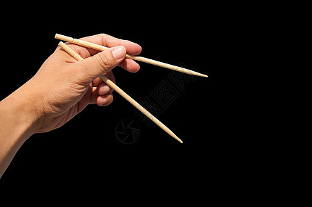 手和竹筷图片