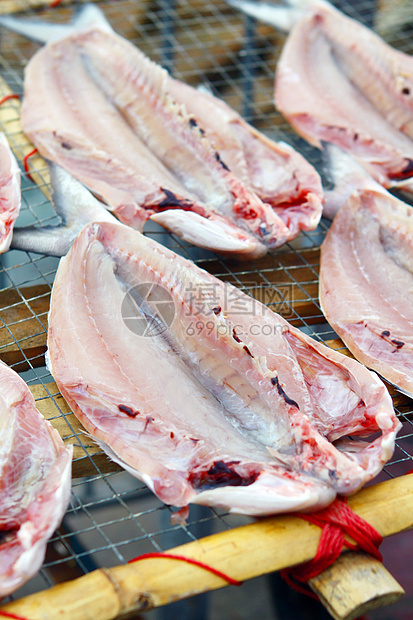 中华文化中的干鱼餐厅环境盐渍绳索太阳美食市场烹饪海洋寿司图片