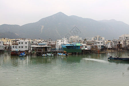 香港Tai O渔业村房子蓝色钓鱼木头窝棚村庄住宅爬坡旅行场景图片