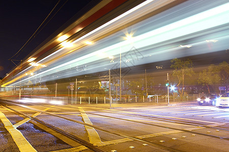 香港夜间的轻型铁路蓝色轻轨商业辉光速度运输戏剧性旅行交通火车图片