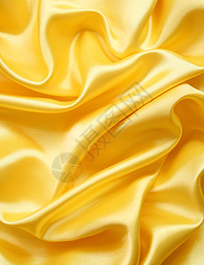 平滑优雅的金金丝绸纺织品投标丝绸涟漪布料曲线折痕织物材料黄色图片