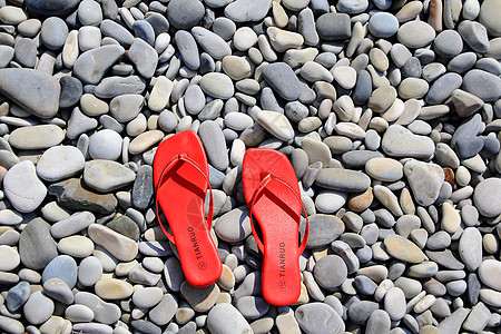 变化多端的思索主义者海滨鞋类海滩红色杂色女性化假期卵石背景
