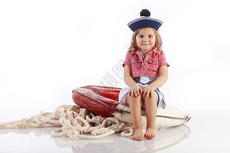赛艇条纹童年女孩红色衣服海军白色救生圈孩子海滩图片