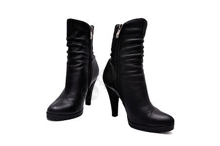 妇女靴子拉链高跟鞋衣服皮革黑色背景图片