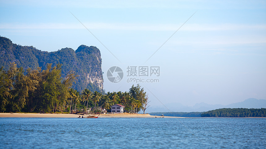 热带度假地晴天房子尾巴天蓝色海岸岩石海洋异国天空海滩图片