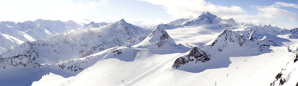 阿尔卑斯山高地冰川滑雪天空石头白色顶峰首脑高山岩石蓝色图片