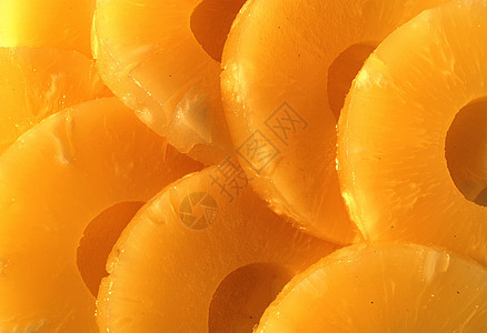 黄罐头菠萝环 素食戒指水果生活方式黄色横截面菠萝圆圈食物图片