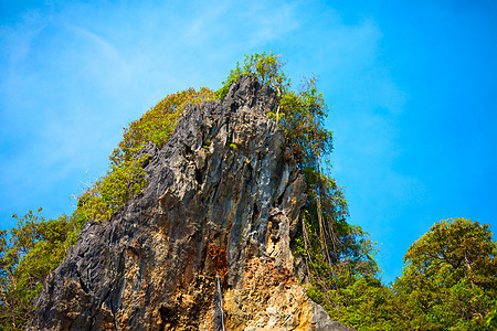 泰国山天空生态热带悬崖晴天太阳岩石风景丛林灌木丛图片