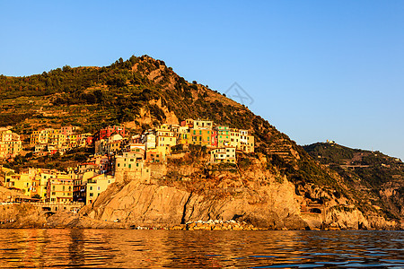 意大利辛克特尔岛马纳罗拉村日落海岸海岸线橙子蓝色悬崖村庄旅行港口岩石假期图片