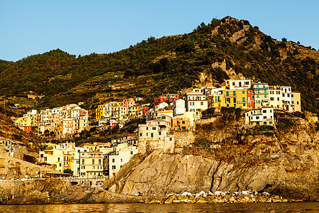 意大利辛克特尔岛马纳罗拉村日落旅行海岸大地钓鱼橙子房子旅游海岸线蓝色天空图片