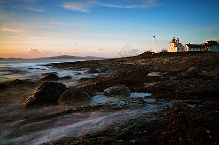 图尼内斯弗里尔地景景观灯塔自然界海藻海岸波浪海岸线日落岩石图片