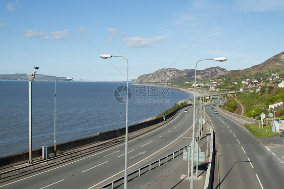 海岸公路车道山脉人行道旅游蓝色基础设施栏杆天空运输丘陵图片