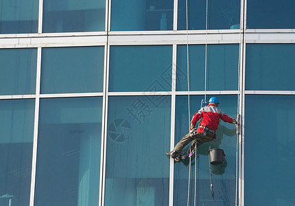 攀爬者  窗口清洁器建筑服务垫圈工人商业洗涤登山者危险城市窗户图片