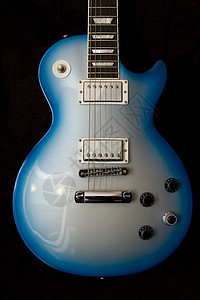 蓝色吉他字符串乐器摄影脖子音乐木头岩石指板照片背景图片