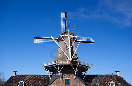 荷兰风车建筑天空村庄传统蓝色天气旅游风景乡村阳光图片