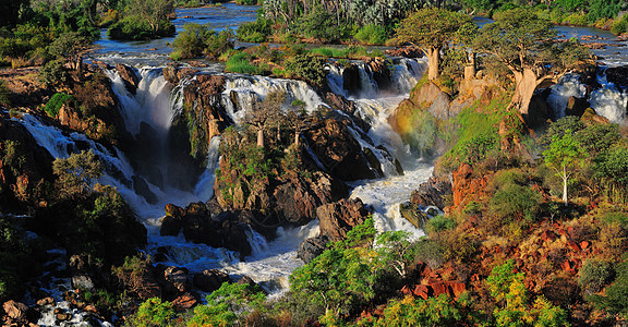 Epupa 瀑瀑图全景 纳米比亚阴影急流洪水巨石日落彩虹太阳悬崖峡谷岩石图片