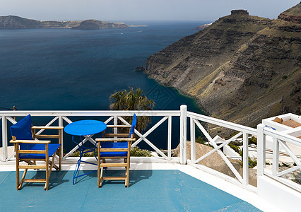 Caldera 视图海岸线地平线悬崖椅子船只天空蓝色文化白色桌子图片
