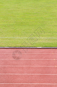 与草场一起运行的轨道跑步地面橙子车道团队竞赛运动时间红色爱好图片