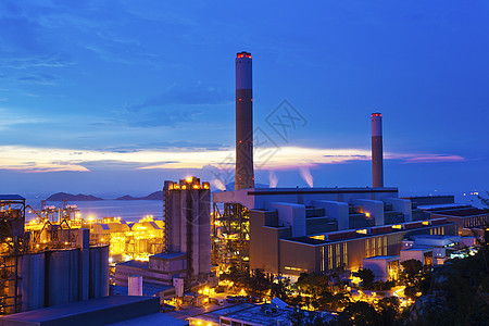 日落时香港的发电厂化学烟囱金属技术变压器桅杆活力环境生产植物背景图片