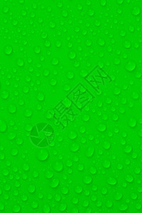 绿背景的滴水水分雨滴飞沫水滴绿色淬火口渴雨水宏观图片