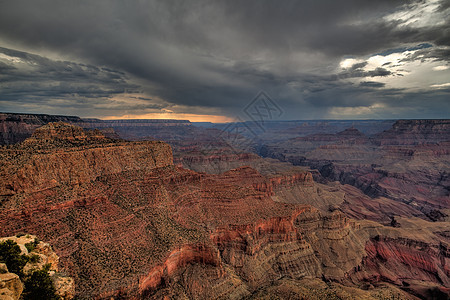 大峡谷纪念碑荒野石头橙子阴影沙漠山脉地平线风暴日落图片